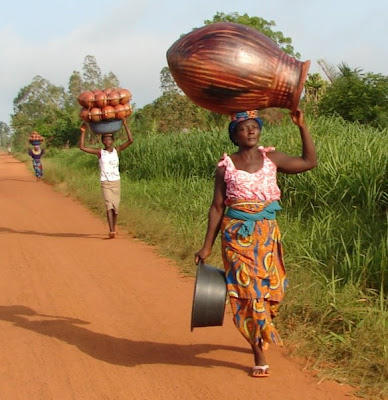 Woman carrying finished pot