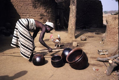 woman cleaning pot